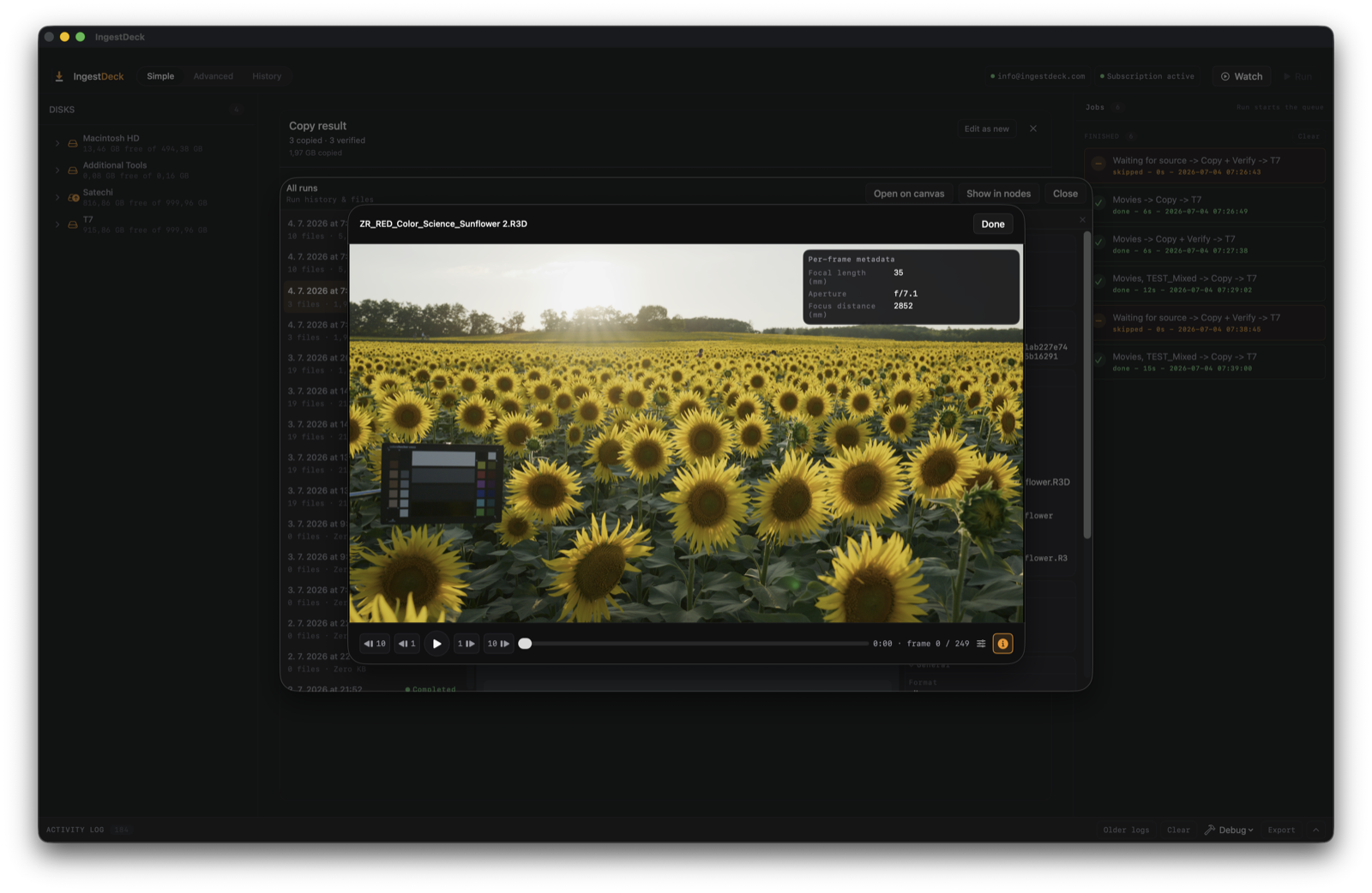 The media player decoding a RED R3D natively — frame-accurate transport, frame counter, and the per-frame metadata overlay showing focal length, aperture and focus distance.